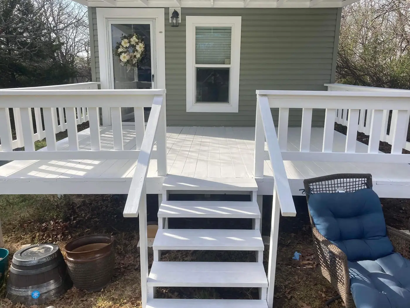 Wood porch and deck after professional painting in Tulsa
